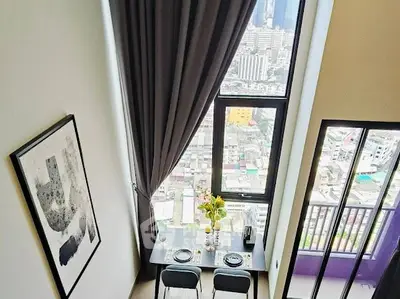 Stunning high-rise apartment with floor-to-ceiling windows and city view