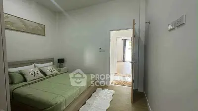 Cozy bedroom with green bedding and minimalist decor