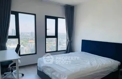 Modern bedroom with stunning city view and sleek furnishings