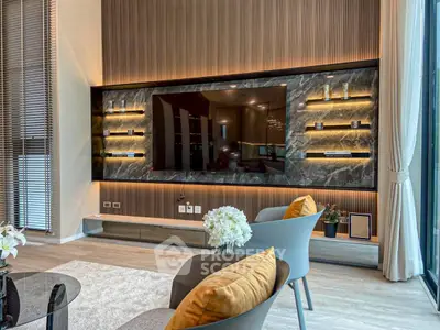 Luxurious modern living room with elegant decor and large TV display