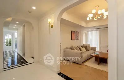 Elegant living room with modern lighting and cozy seating area