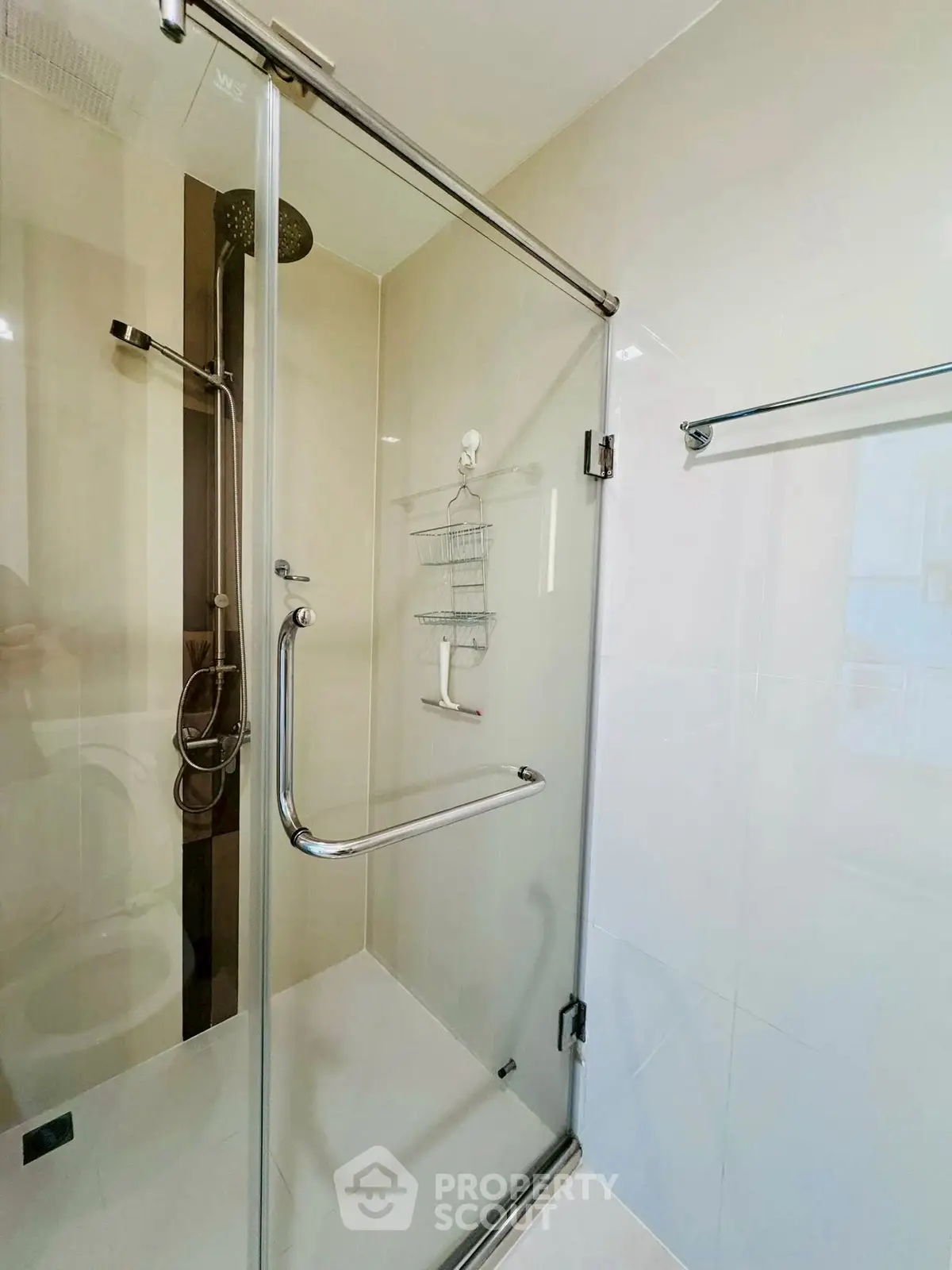Modern bathroom with glass shower enclosure and sleek fixtures