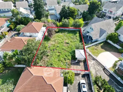Prime residential land plot in a serene neighborhood with lush greenery, ideal for building a dream home.