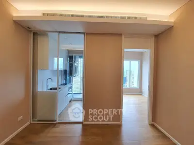 Modern apartment interior with open kitchen and wooden flooring