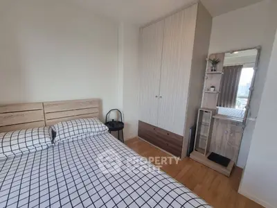 Modern bedroom with stylish decor and ample storage space