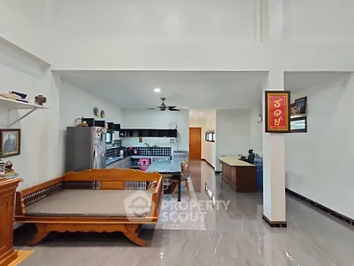 Spacious open-plan living area with modern kitchen and elegant decor