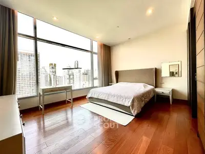 Spacious bedroom with stunning city view and modern furnishings