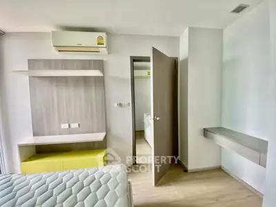 Modern bedroom with minimalist design and built-in air conditioning