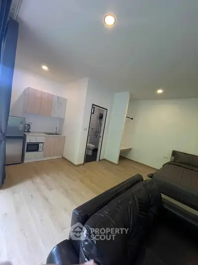 Modern studio apartment with open kitchen and cozy living area