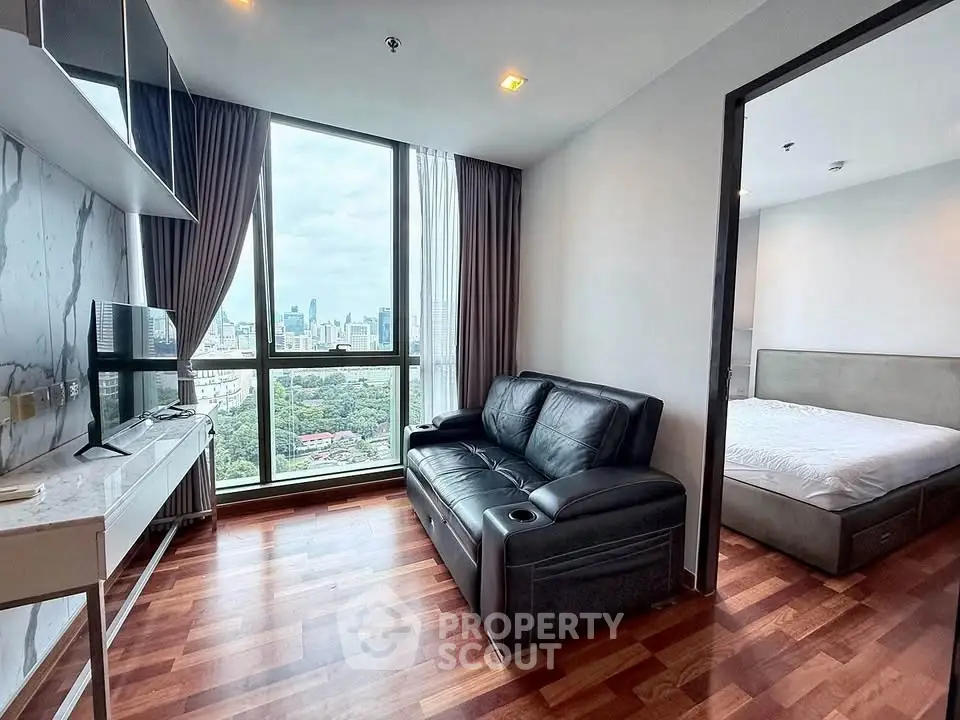 Modern apartment with stunning city view, cozy living room, and elegant bedroom.