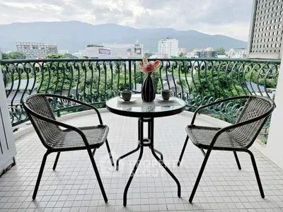Charming balcony with mountain view, perfect for relaxation and enjoying morning coffee.