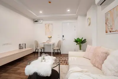 Cozy modern living room with elegant decor and plush seating