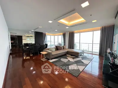 Spacious modern living room with large windows and elegant decor