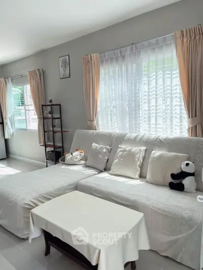 Bright and cozy living room with plush sofa and natural light