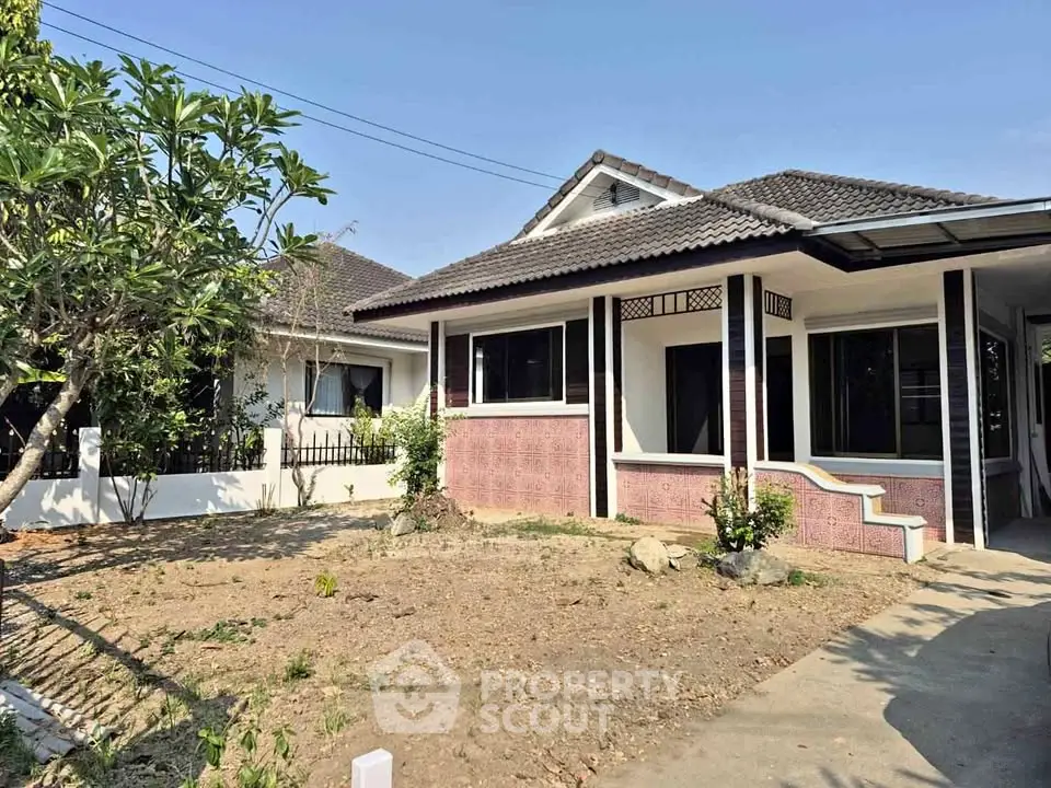 Charming single-story house with spacious yard and traditional design, perfect for family living.