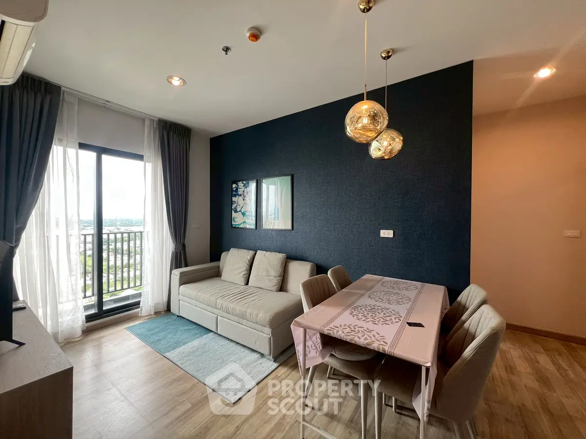 Modern living room with elegant dining area and balcony view