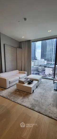 Luxurious modern living room with city view and elegant furnishings.