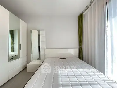 Bright minimalist bedroom with large wardrobe and green curtains