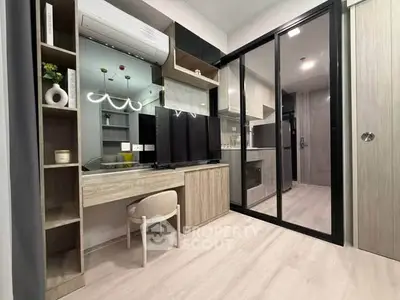 Modern living room with sleek furniture and glass partition in stylish apartment
