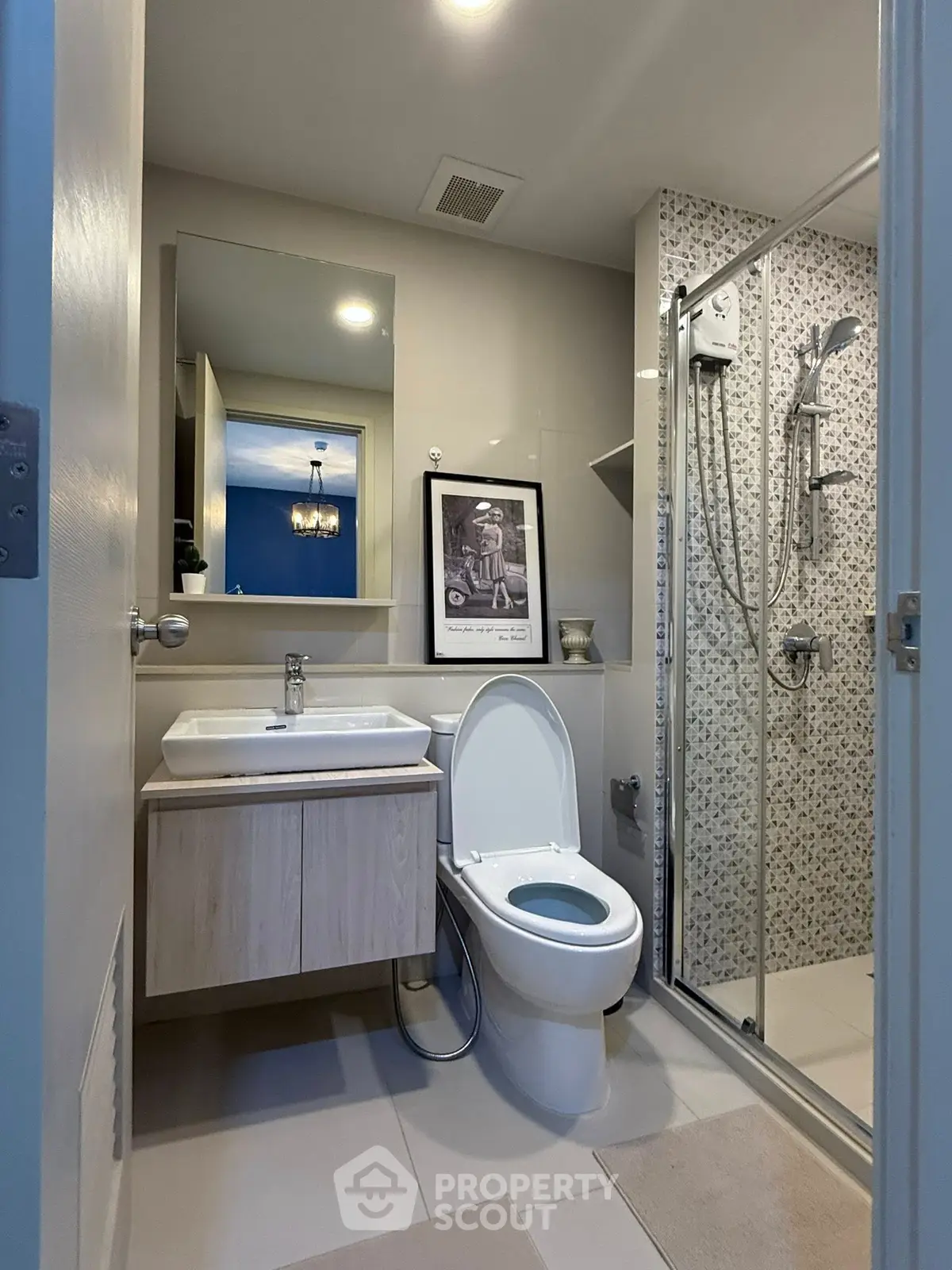 Modern bathroom with sleek fixtures and glass shower enclosure