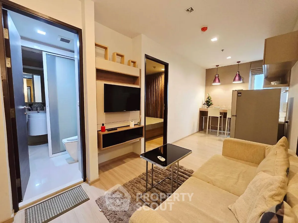 Modern apartment interior with cozy living room and open kitchen layout
