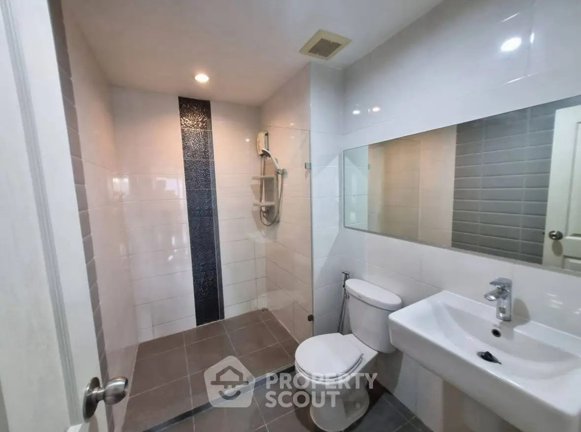 Modern bathroom with sleek design and spacious shower area