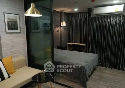 Modern studio apartment with cozy living area and stylish decor