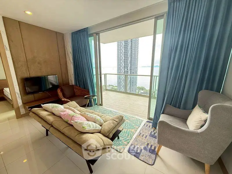 Modern living room with balcony and stunning city view, featuring stylish furniture and floor-to-ceiling windows.