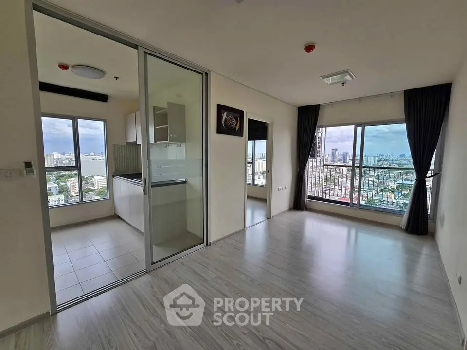 Spacious corner unit with panoramic city views and modern open layout.