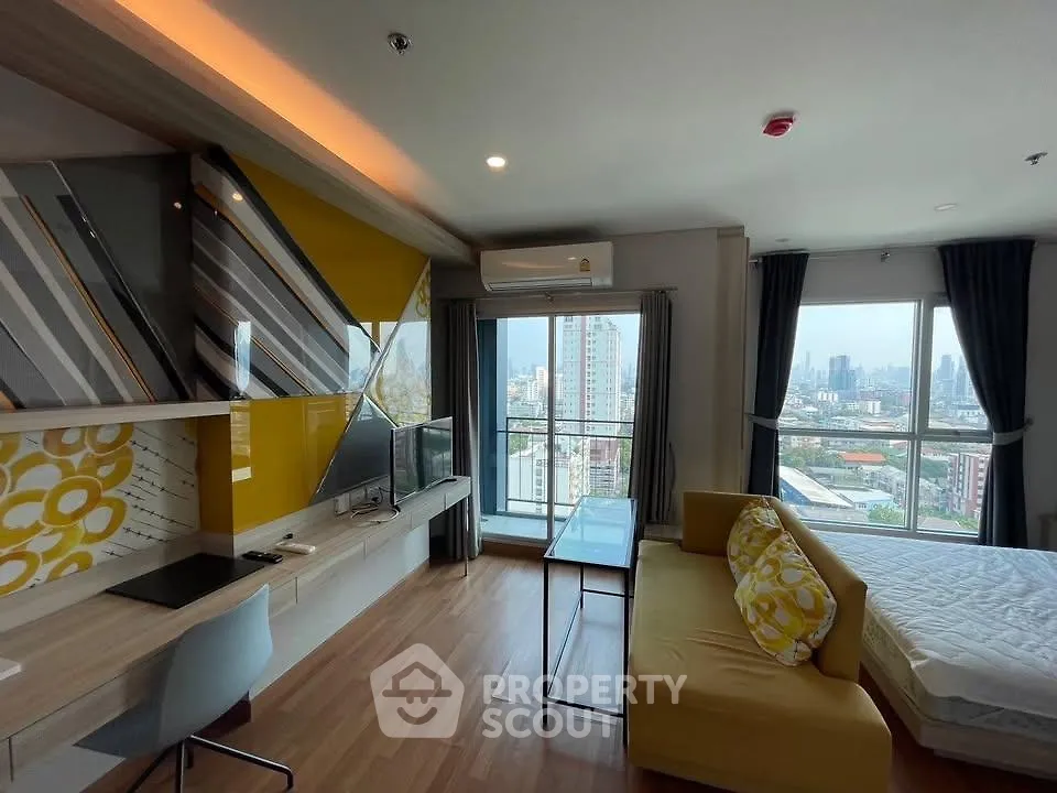 Modern studio apartment with vibrant decor and stunning city view, featuring open layout and stylish furnishings.