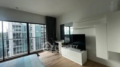 Modern bedroom with balcony view in urban apartment