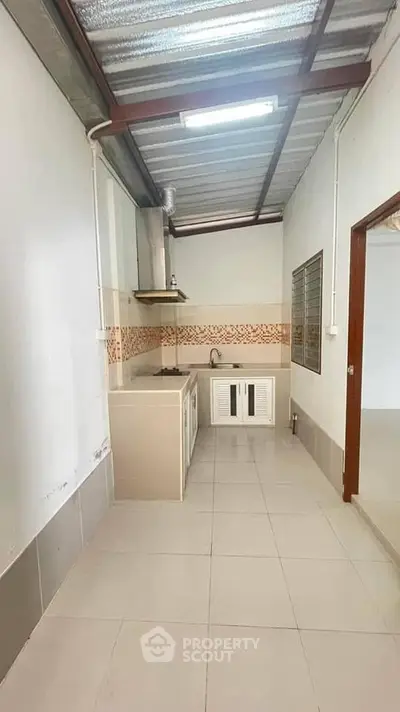 Modern kitchen with sleek design and gas stove in a compact layout