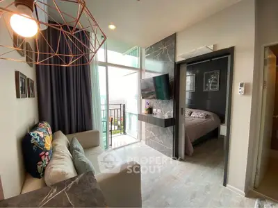 Modern living room with stylish decor and bedroom view in a cozy apartment