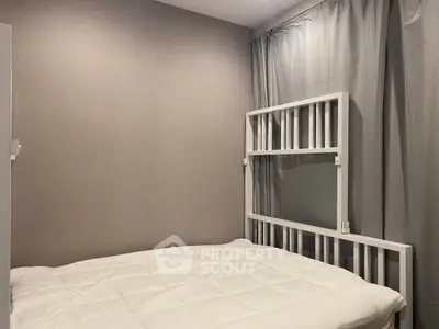 Cozy bedroom with minimalist decor and soft lighting, perfect for relaxation.