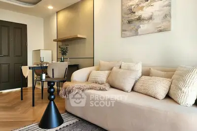 Stylish modern living room with cozy beige sofa and elegant dining area, perfect for urban living.