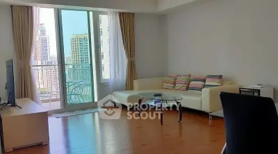 Spacious living room with balcony and city view in modern apartment