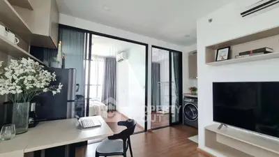 Modern apartment interior with open layout, featuring a stylish kitchen and cozy living area.