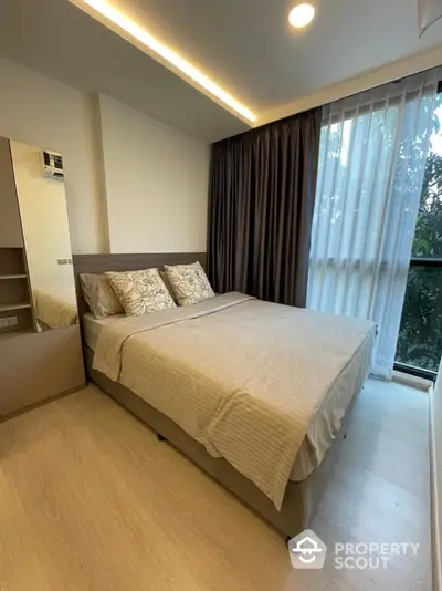 Serene bedroom with modern design, ambient lighting, and a view of lush greenery through large windows, perfect for relaxation.