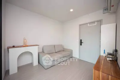 Modern minimalist living room with cozy sofa and sleek wooden furniture