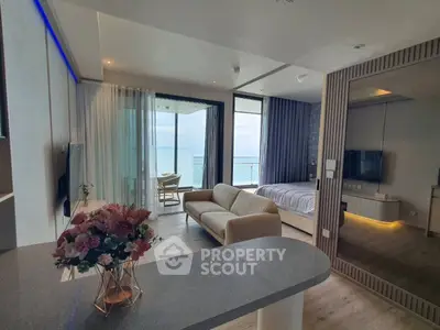Luxurious open-plan living room with ocean view and modern decor
