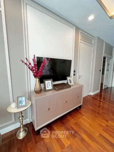 Elegant living room with stylish TV console and wooden flooring