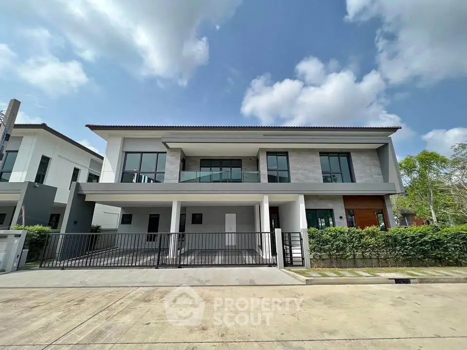 Modern two-story house with sleek design and spacious driveway