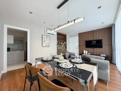 Modern dining and living area with elegant decor and natural light