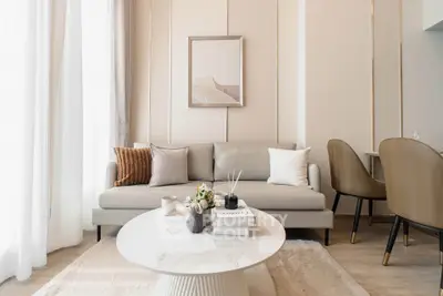 Elegant modern living room with neutral tones and stylish decor