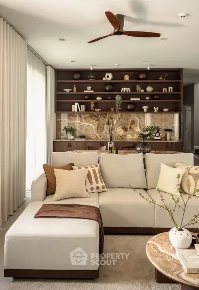 Luxurious living room with elegant decor and modern furniture, featuring a stylish ceiling fan and cozy ambiance.