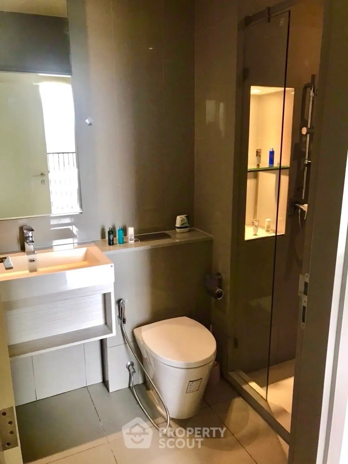 Modern bathroom with sleek fixtures and glass shower enclosure