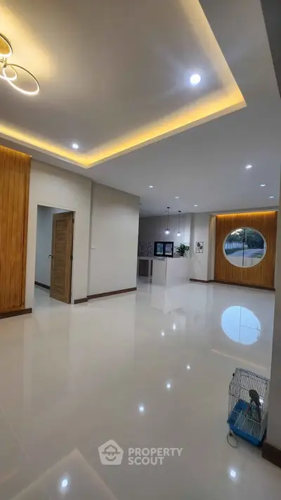 Spacious modern living room with sleek design and elegant lighting