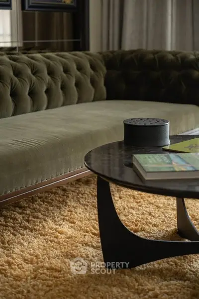 Luxurious living room with plush velvet sofa and modern coffee table on a cozy rug.
