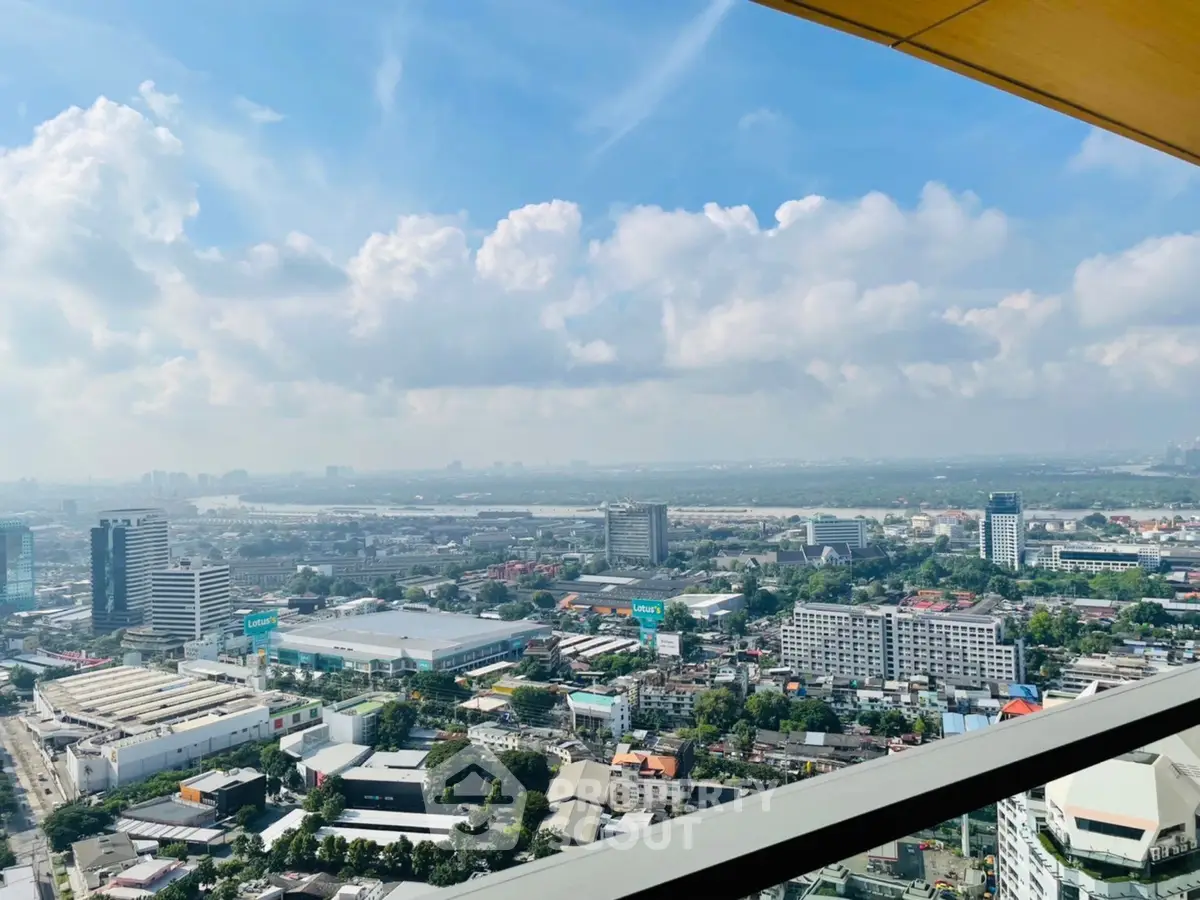 Stunning panoramic cityscape view from a high-rise balcony, showcasing urban skyline and expansive horizon.