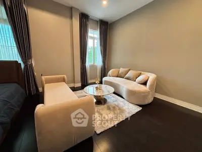 Elegant living room with plush sofas and chic decor, perfect for modern comfort and style.